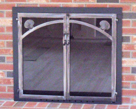 Nauset scallop shell motif black frame and natural iron twin doors with standard smoked glass